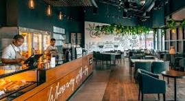 Island café interior with teal seating and wood service counter